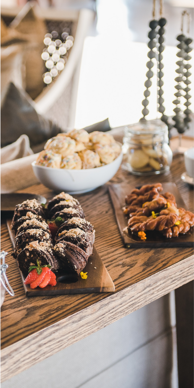 A table adorned with a variety of delectable desserts.