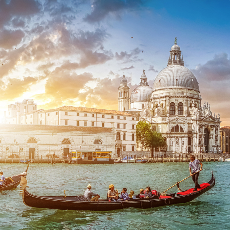 A gondola floating in the water with passengers enjoying a ride in Venice, Italy.