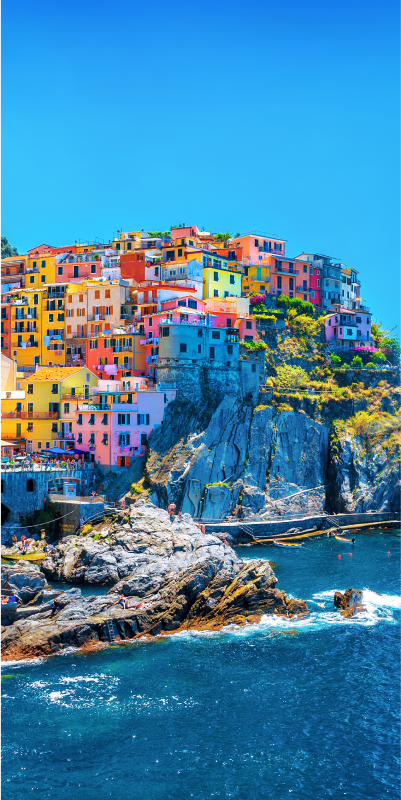a colorful city off the coast overlooking the ocean