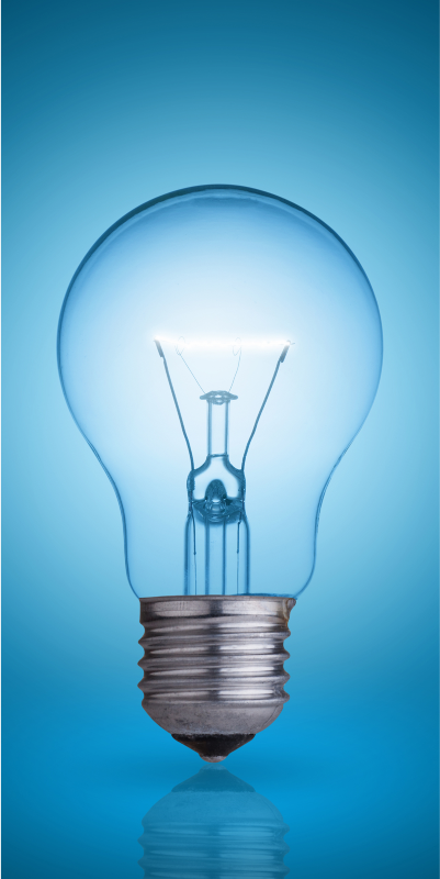 Illuminated light bulb on blue backdrop.