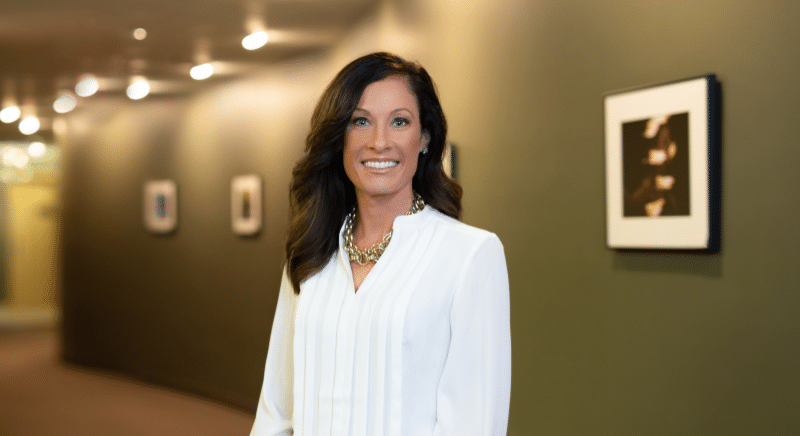 Chief Revenue Officer One10 Poses for Headshot.